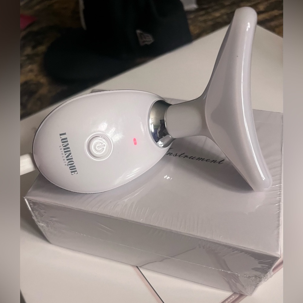 New in Box Lumenique skincare multi purpose device- white